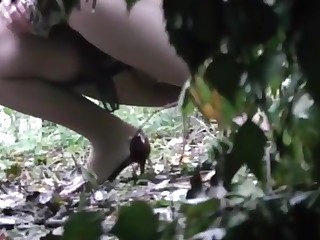 Voyeur is spying and voice-over two girl pissing in the wood